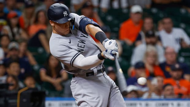 Jul 21, 2022; Houston, Texas, USA; New York Yankees designated hitter Aaron Judge (99) hits a three-run home run during the ninth inning against the Houston Astros at Minute Maid Park.